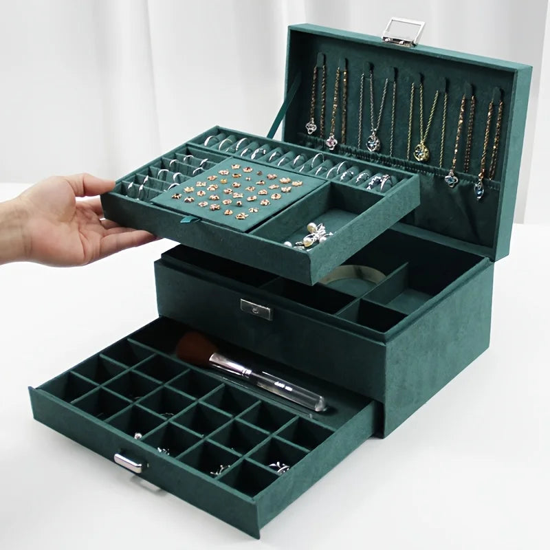 Eine luxuriöse, dunkelgrüne Schmuckaufbewahrungsbox, speziell entworfen als exquisite dreistöckige Schmuckschatulle mit Schubladen